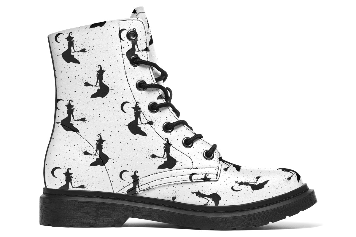 White boots with a repetitive black pattern of the silhouettes of witches on broomsticks