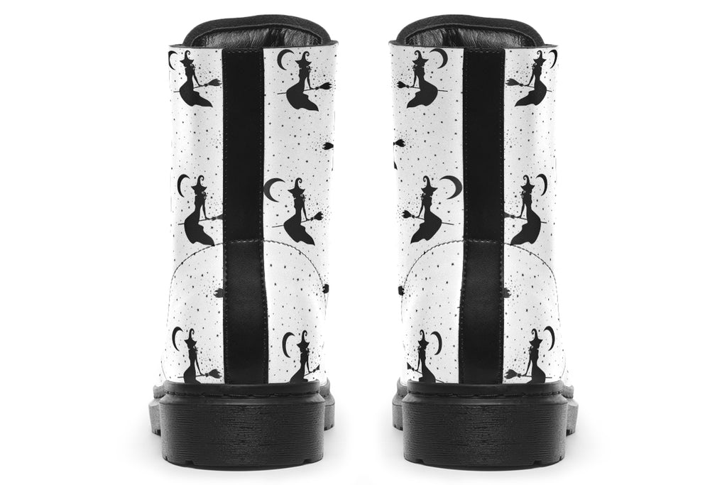 White boots with a repetitive black pattern of the silhouettes of witches on broomsticks
