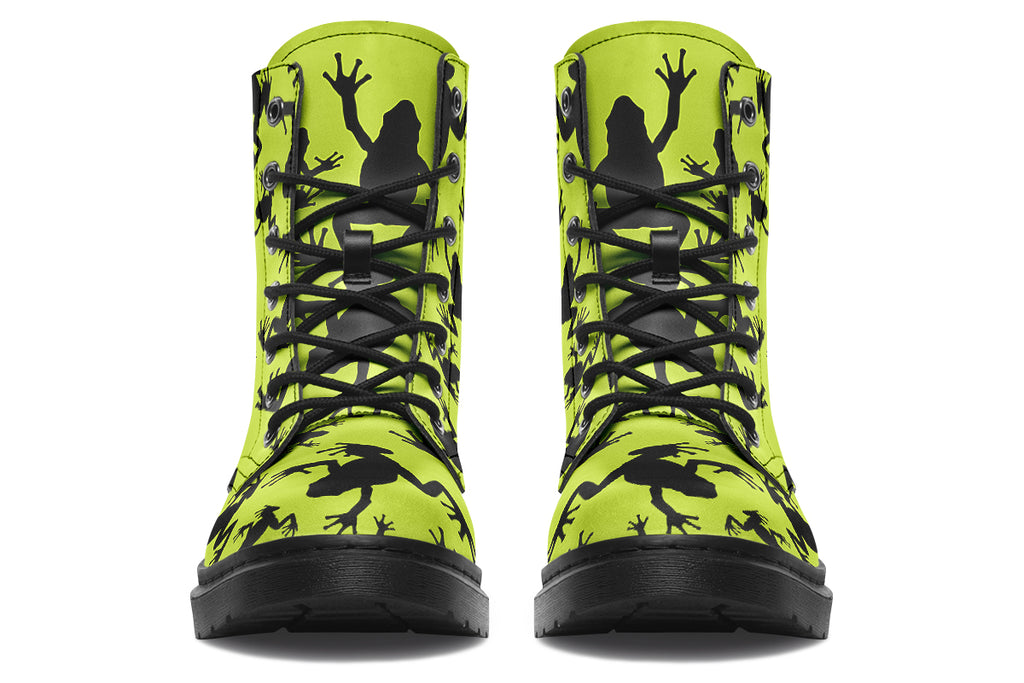 Design features black frog silhouettes on a vibrant green background.