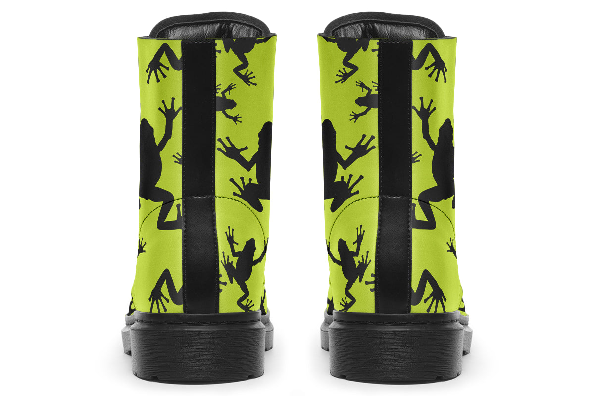 Design features black frog silhouettes on a vibrant green background.