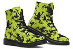 Design features black frog silhouettes on a vibrant green background.
