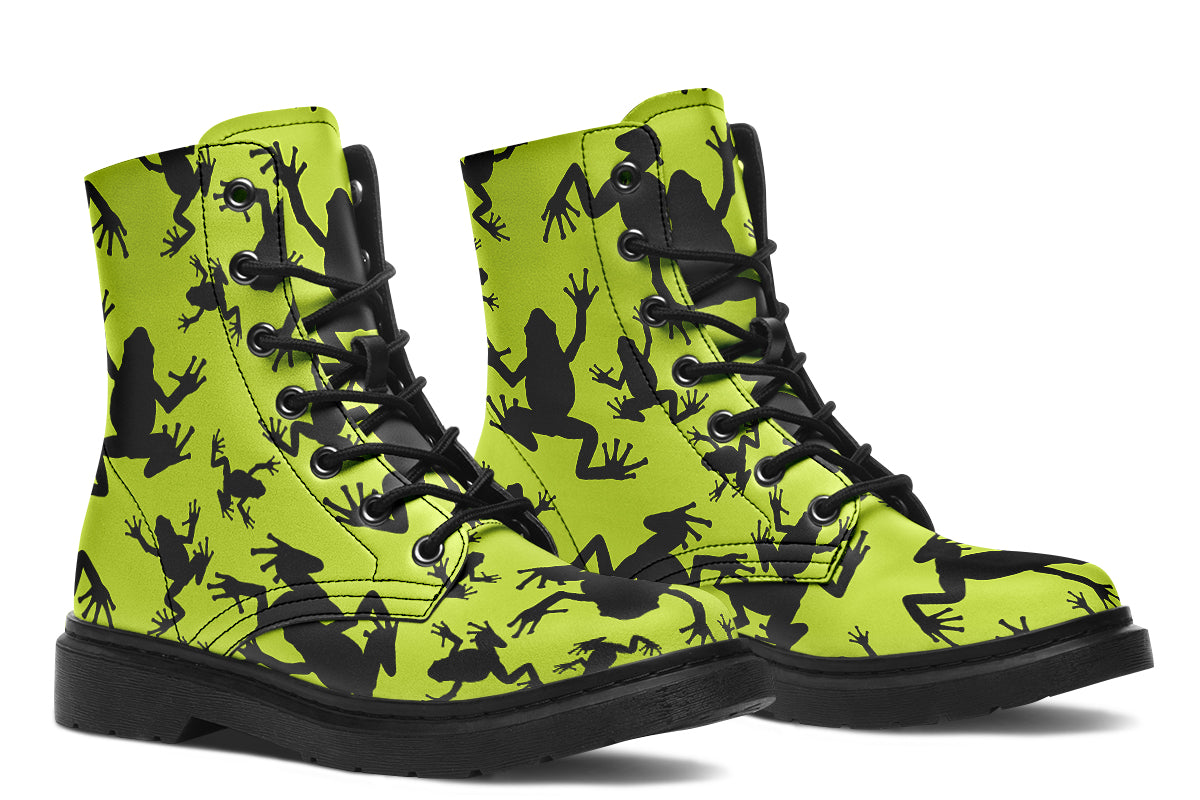 Design features black frog silhouettes on a vibrant green background.