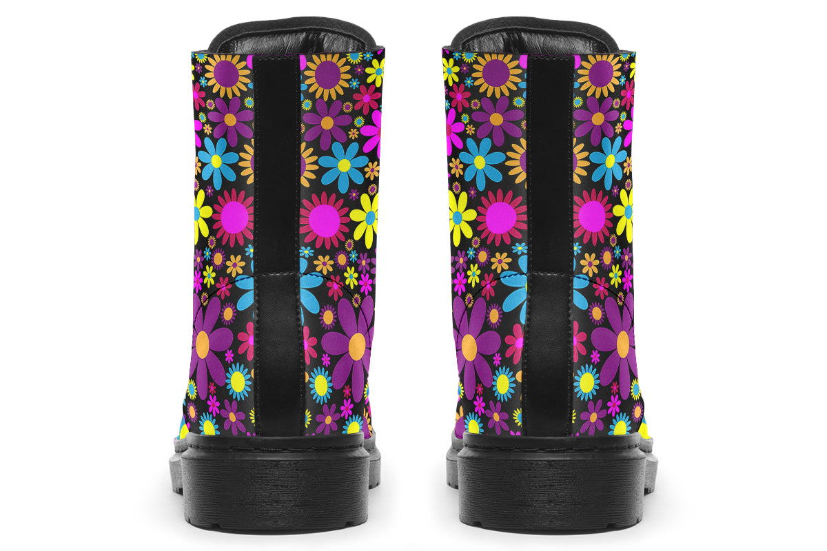 Black boots with a retro floral design in pinks, purples and yellows.