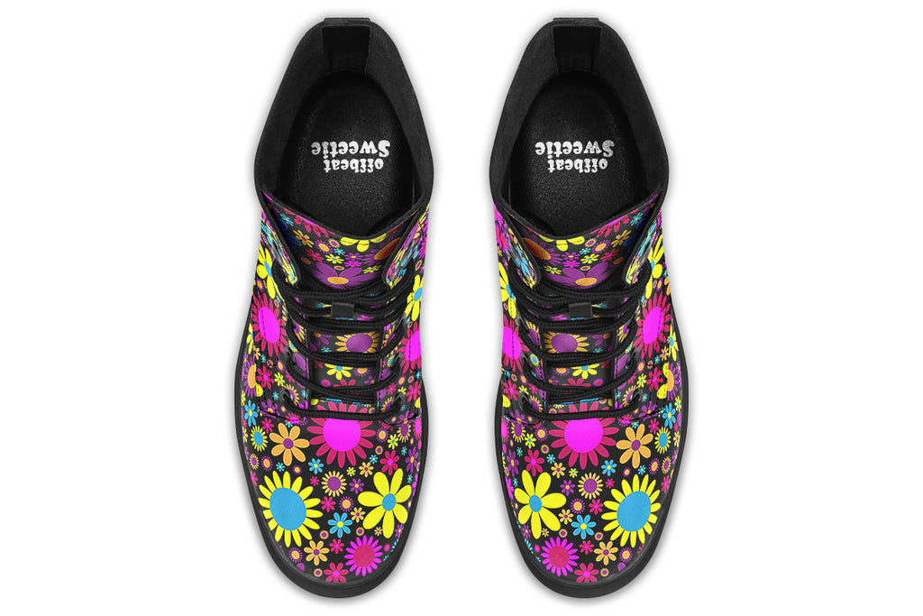 Black boots with a retro floral design in pinks, purples and yellows.