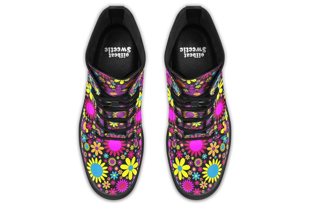 Black boots with a retro floral design in pinks, purples and yellows.