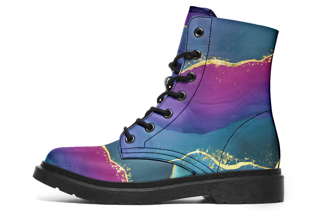 Boots featuring a geode design in purples, blues and pinks, with stripes of gold diving some of the colours.