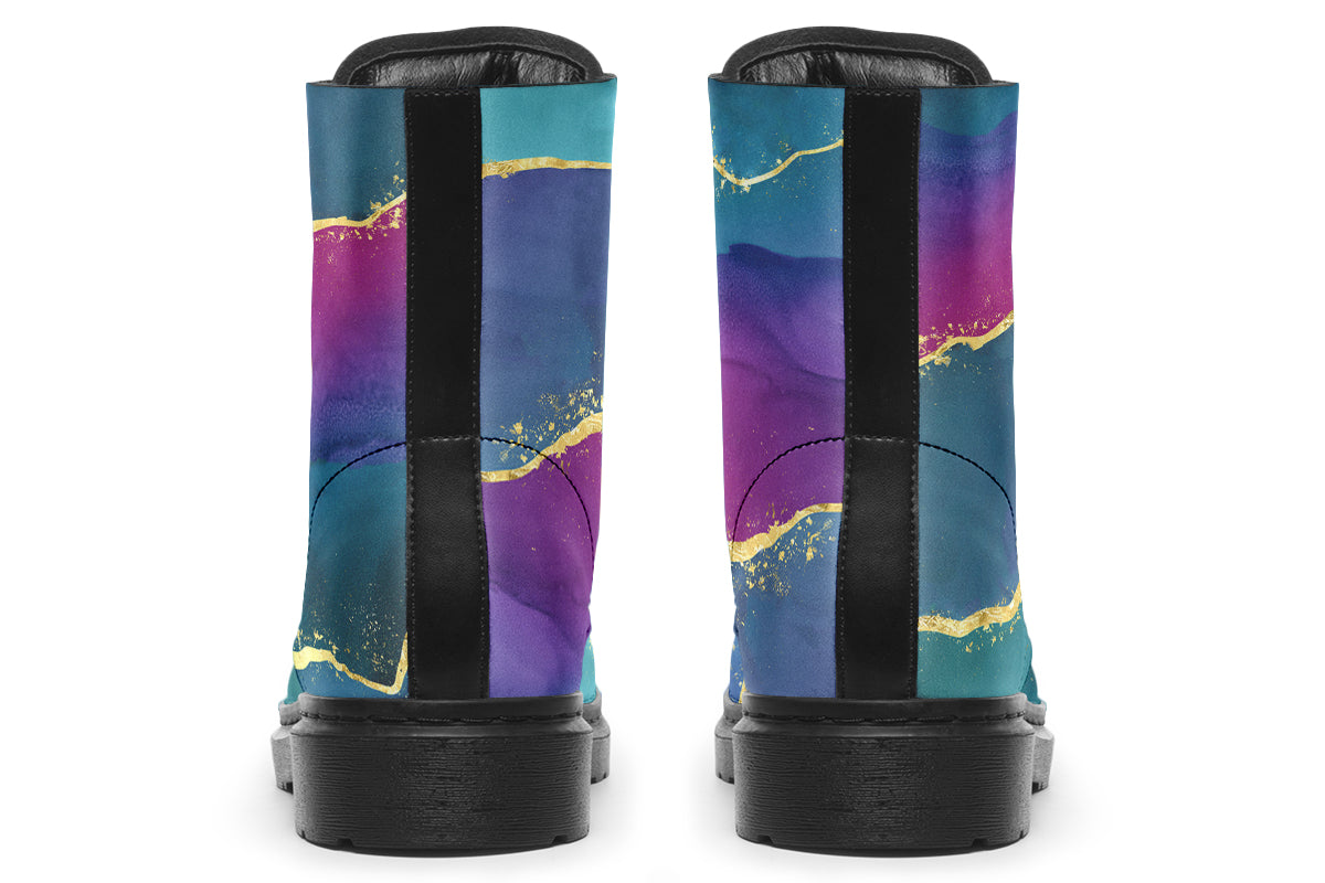 Boots featuring a geode design in purples, blues and pinks, with stripes of gold diving some of the colours.