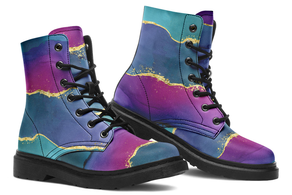Boots featuring a geode design in purples, blues and pinks, with stripes of gold diving some of the colours.