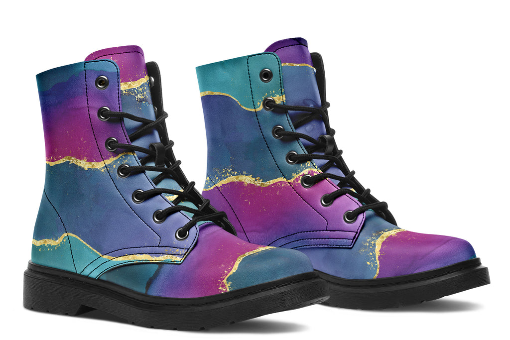 Boots featuring a geode design in purples, blues and pinks, with stripes of gold diving some of the colours.