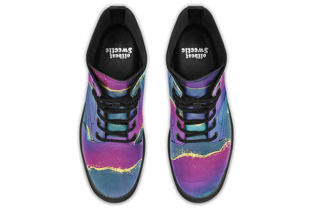 Boots featuring a geode design in purples, blues and pinks, with stripes of gold diving some of the colours.