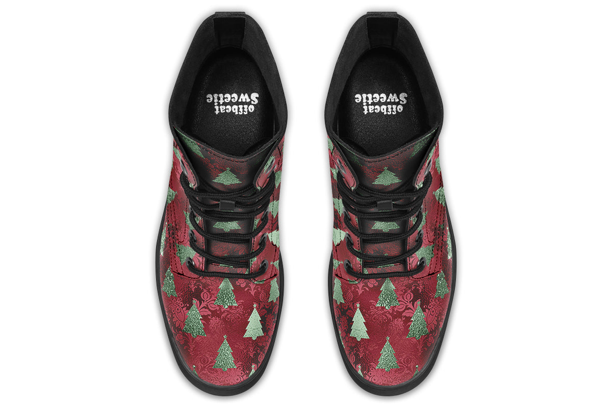 These boots feature a deep red patterned background, like something you might find on a Christmas table cloth. There are green Christmas trees over the red, designed to look like they are textured and shimmering.