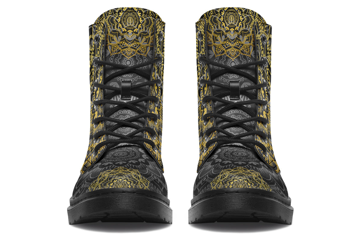 Black boots with a gold/yellow mandala design.
