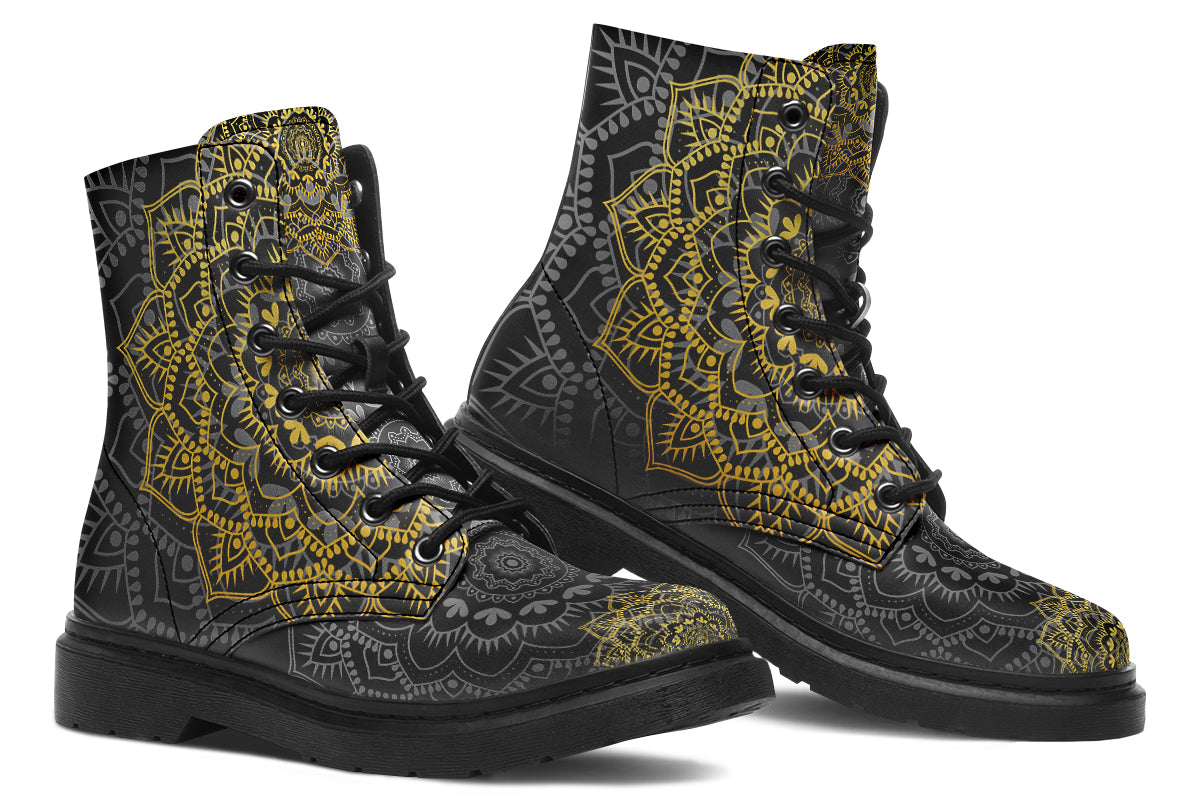 Black boots with a gold/yellow mandala design.