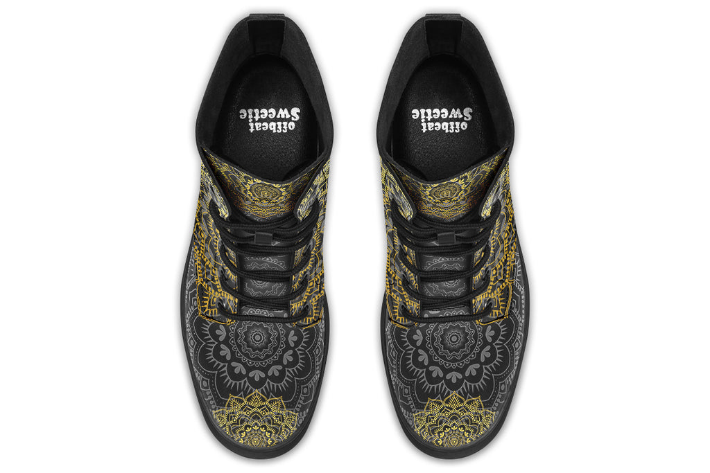 Black boots with a gold/yellow mandala design.