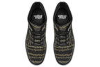 Black boots with a black sole, featuring yellowish/gold sheet music design.