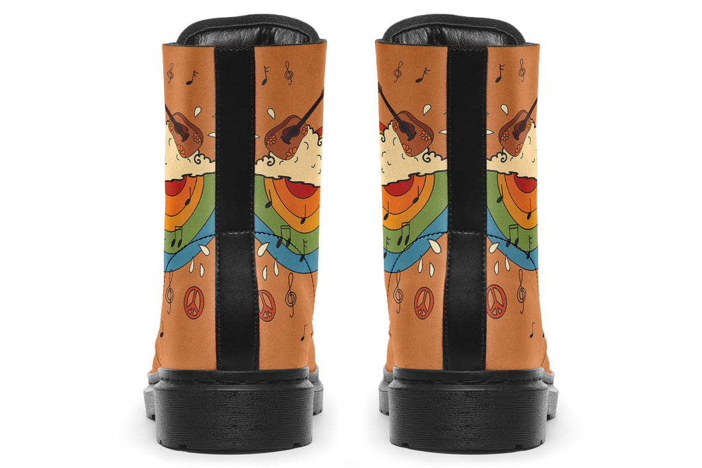 Brown boots with a retro-style design of guitars, clouds, rainbows, peace signs and music notes.