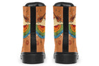 Brown boots with a retro-style design of guitars, clouds, rainbows, peace signs and music notes.