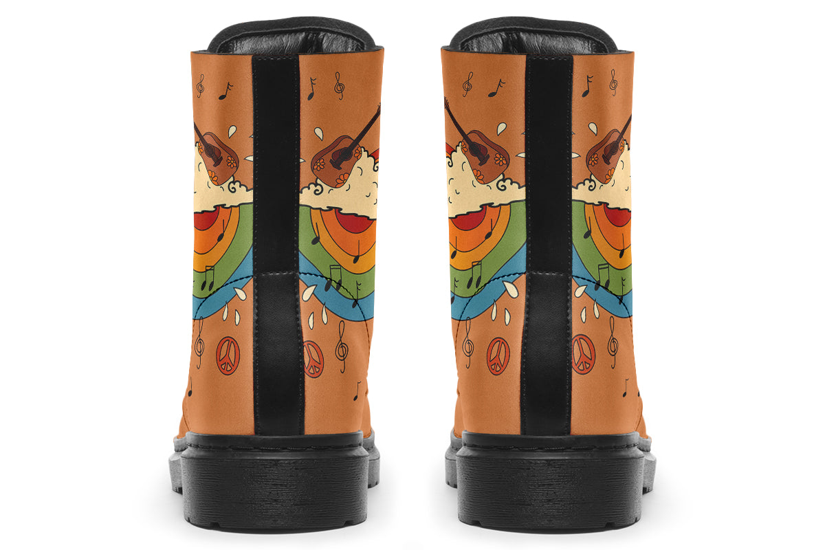 Brown boots with a retro-style design of guitars, clouds, rainbows, peace signs and music notes.