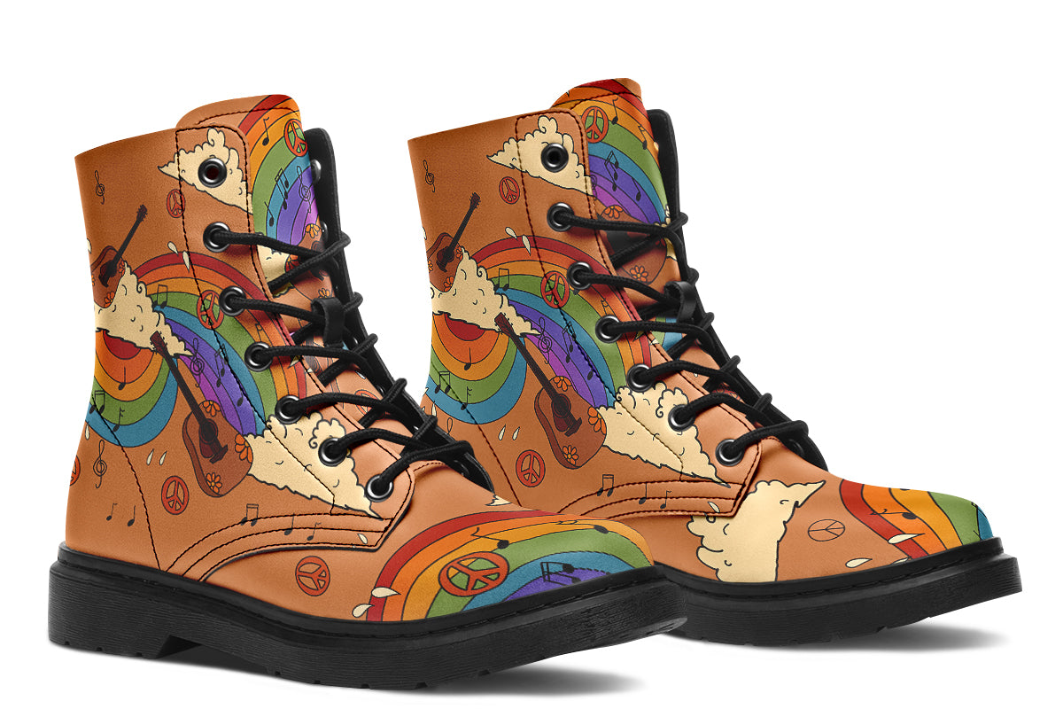 Brown boots with a retro-style design of guitars, clouds, rainbows, peace signs and music notes.
