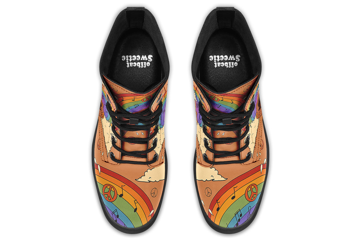 Brown boots with a retro-style design of guitars, clouds, rainbows, peace signs and music notes.