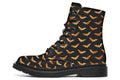 Black boots with an orange bat repetitive pattern.