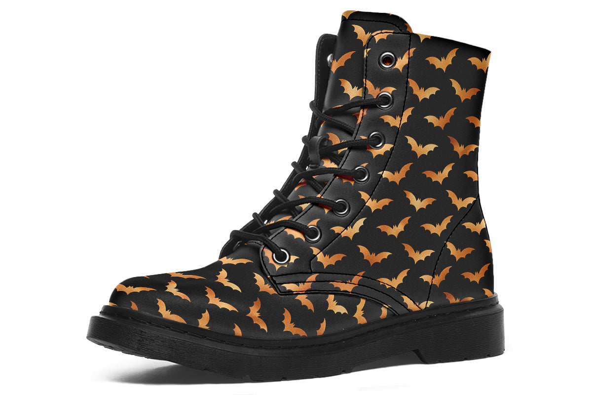 Black boots with an orange bat repetitive pattern.