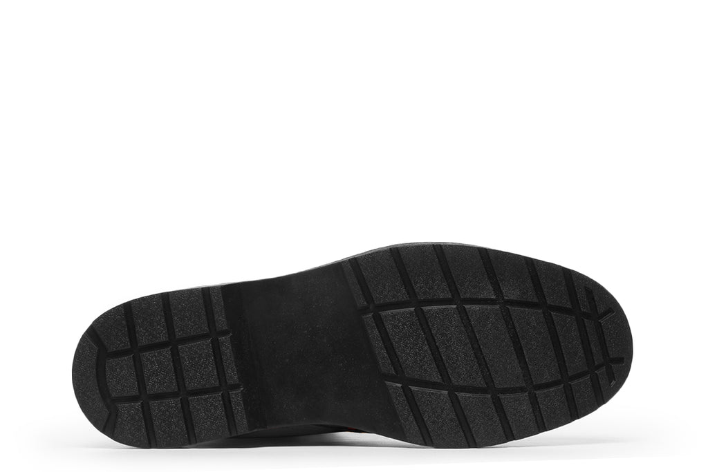 Black boots with an orange bat repetitive pattern.