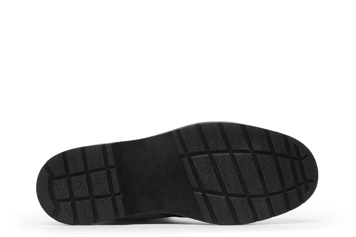 Black boots with an orange bat repetitive pattern.