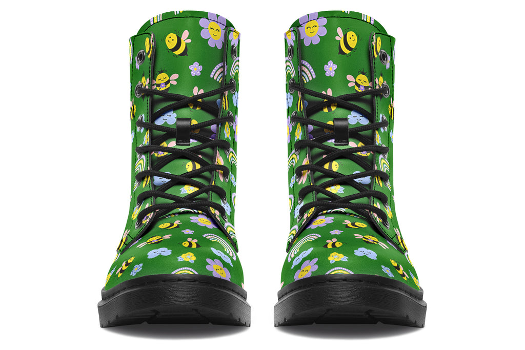 Cute bees and rainbows design on a green background.