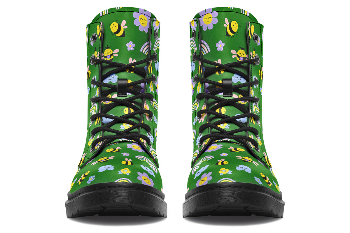 Cute bees and rainbows design on a green background.