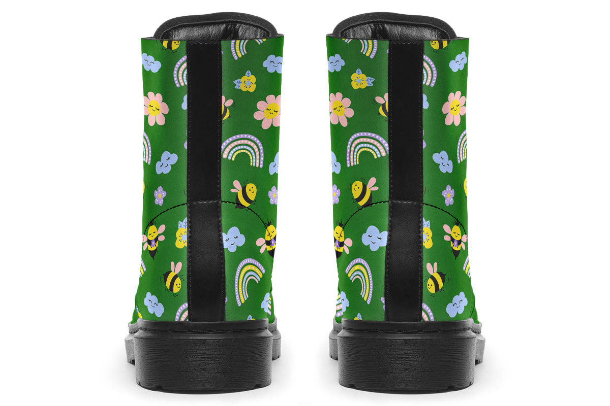 Cute bees and rainbows design on a green background.