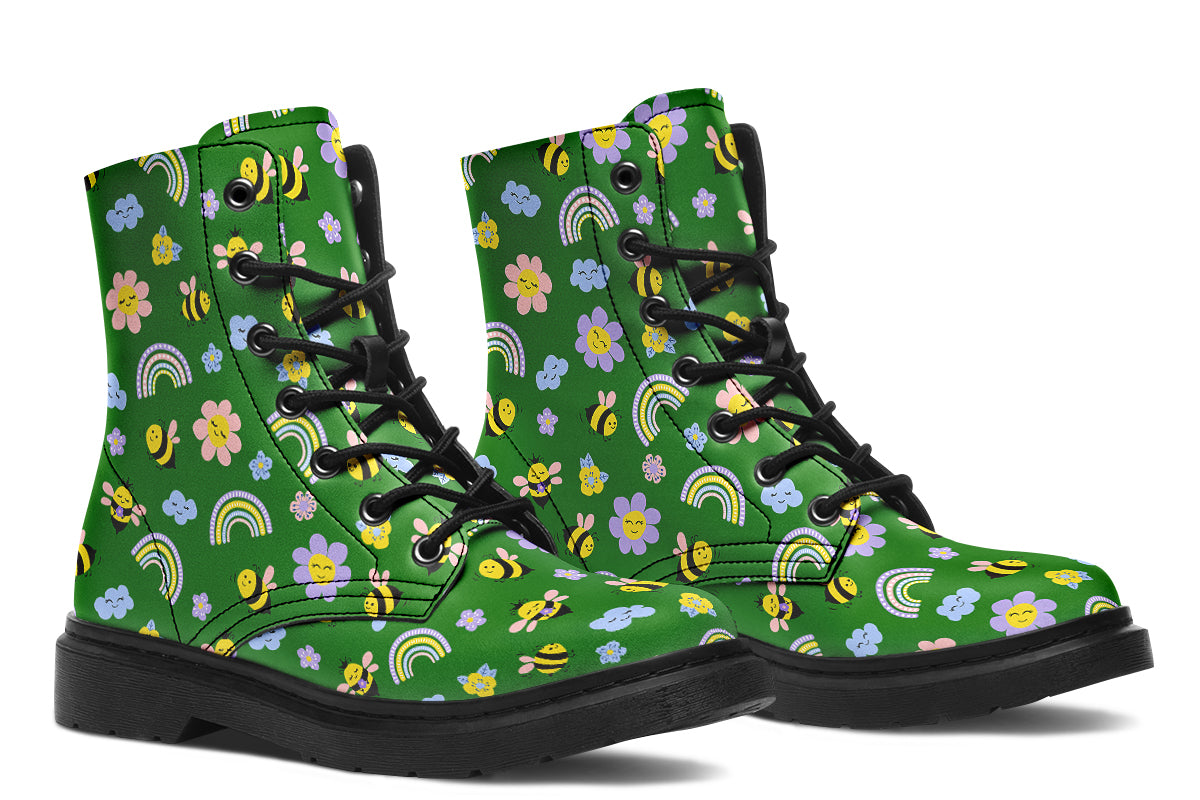 Cute bees and rainbows design on a green background.