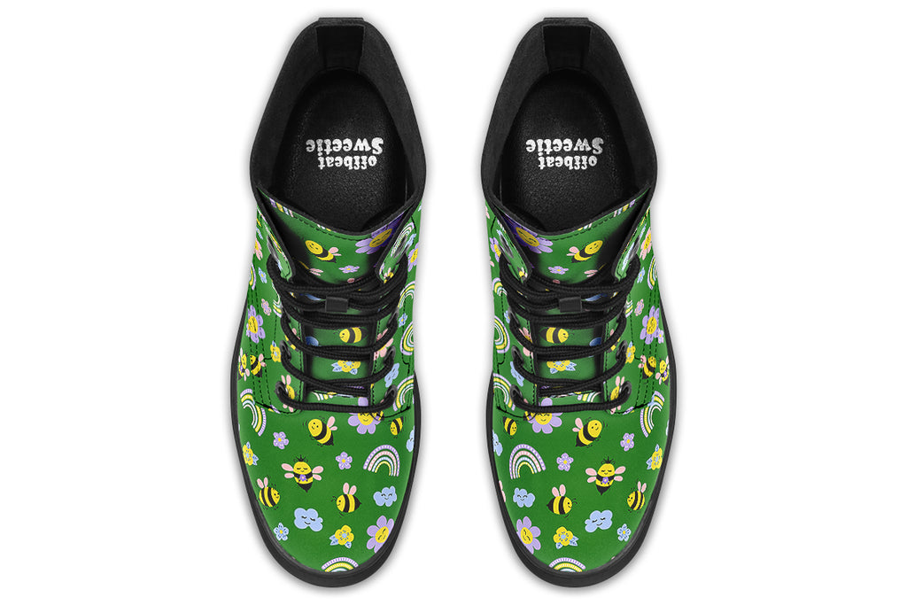 Cute bees and rainbows design on a green background.