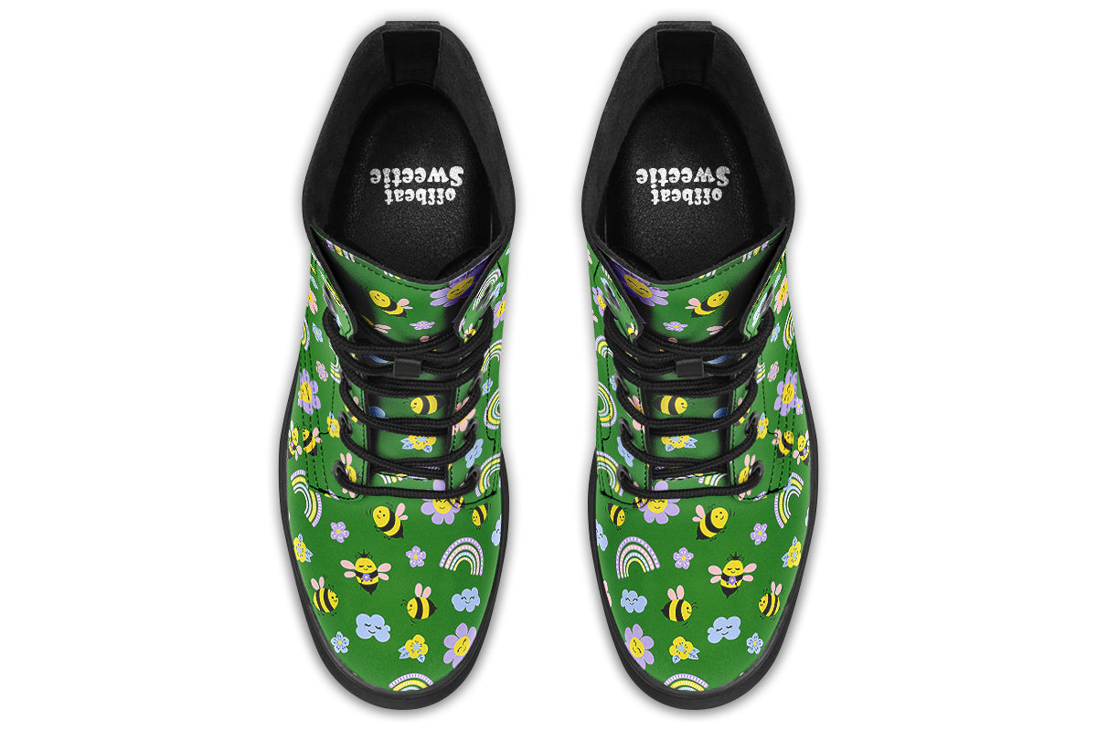 Cute bees and rainbows design on a green background.