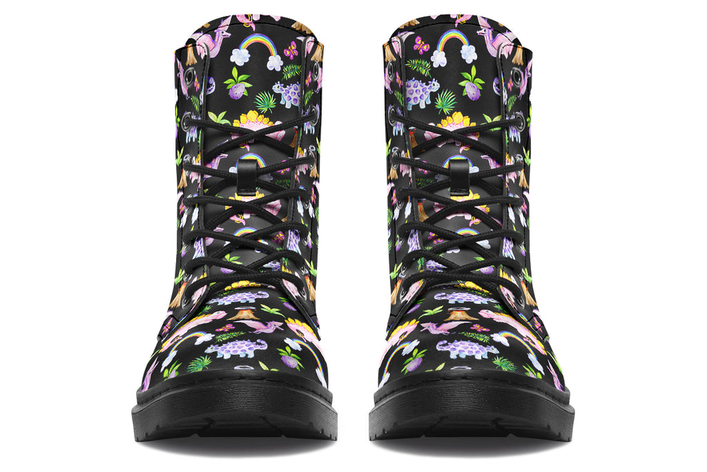 Black boots featuring a patterns of pink and purple dinosaurs, rainbows and plants.
