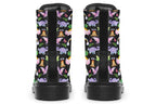Black boots featuring a patterns of pink and purple dinosaurs, rainbows and plants.
