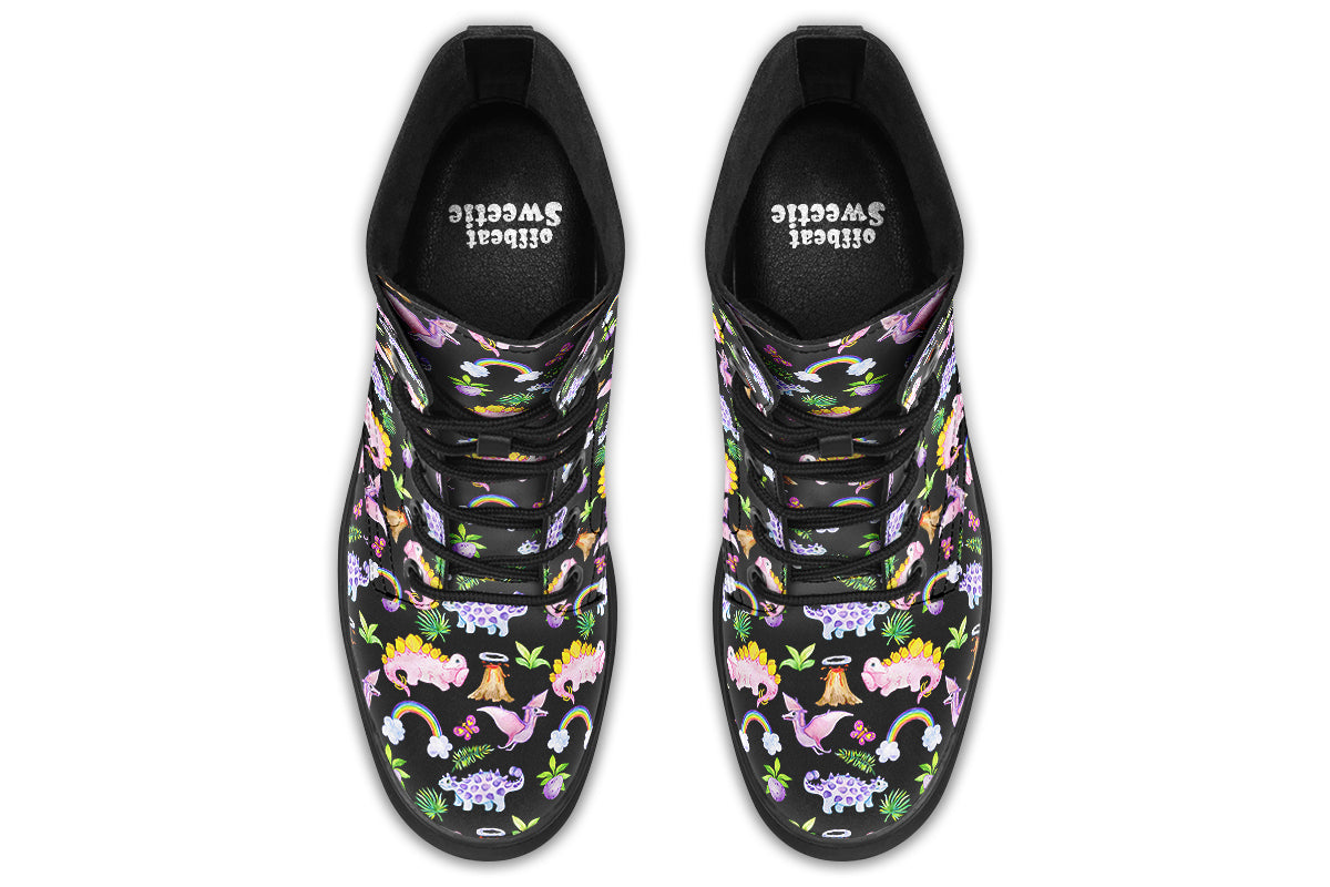 Black boots featuring a patterns of pink and purple dinosaurs, rainbows and plants.