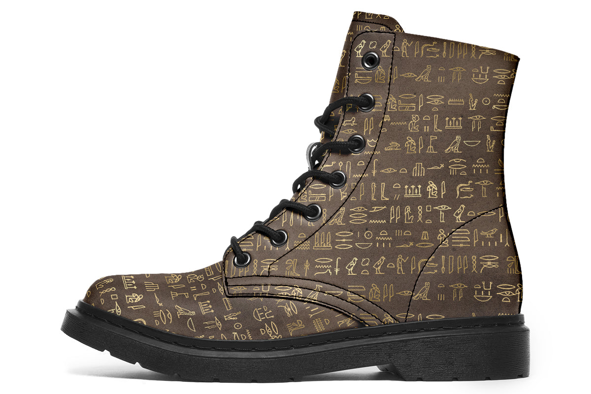 Dark brown boots with a gold hieroglyphics pattern