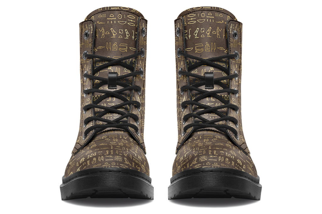 Dark brown boots with a gold hieroglyphics pattern