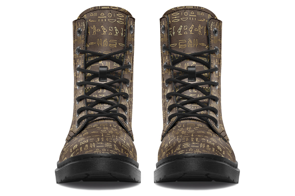 Dark brown boots with a gold hieroglyphics pattern