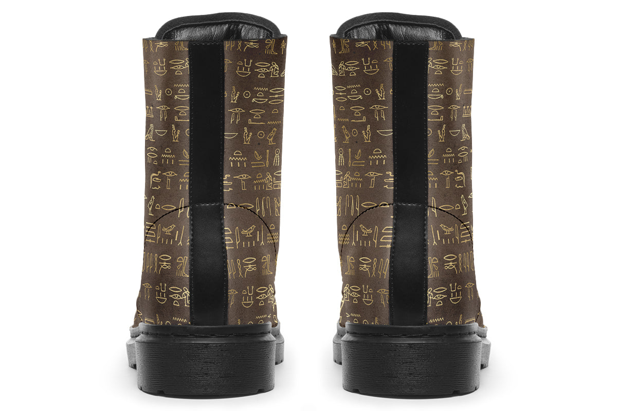 Dark brown boots with a gold hieroglyphics pattern