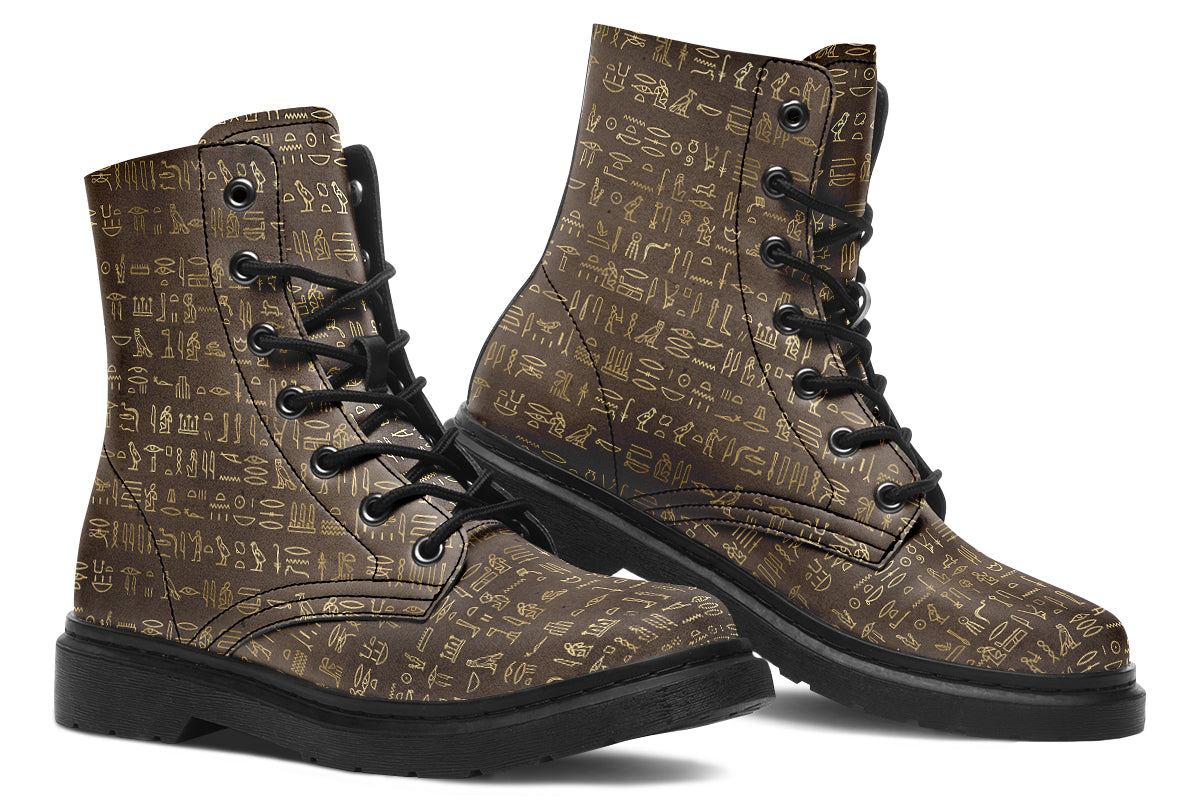 Dark brown boots with a gold hieroglyphics pattern