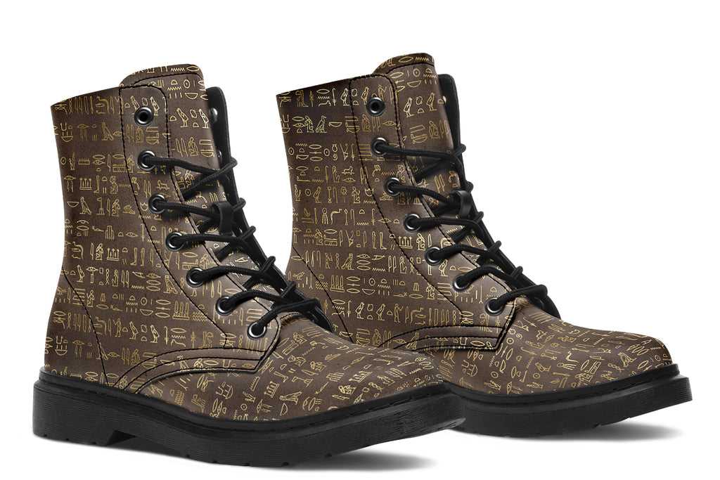 Dark brown boots with a gold hieroglyphics pattern