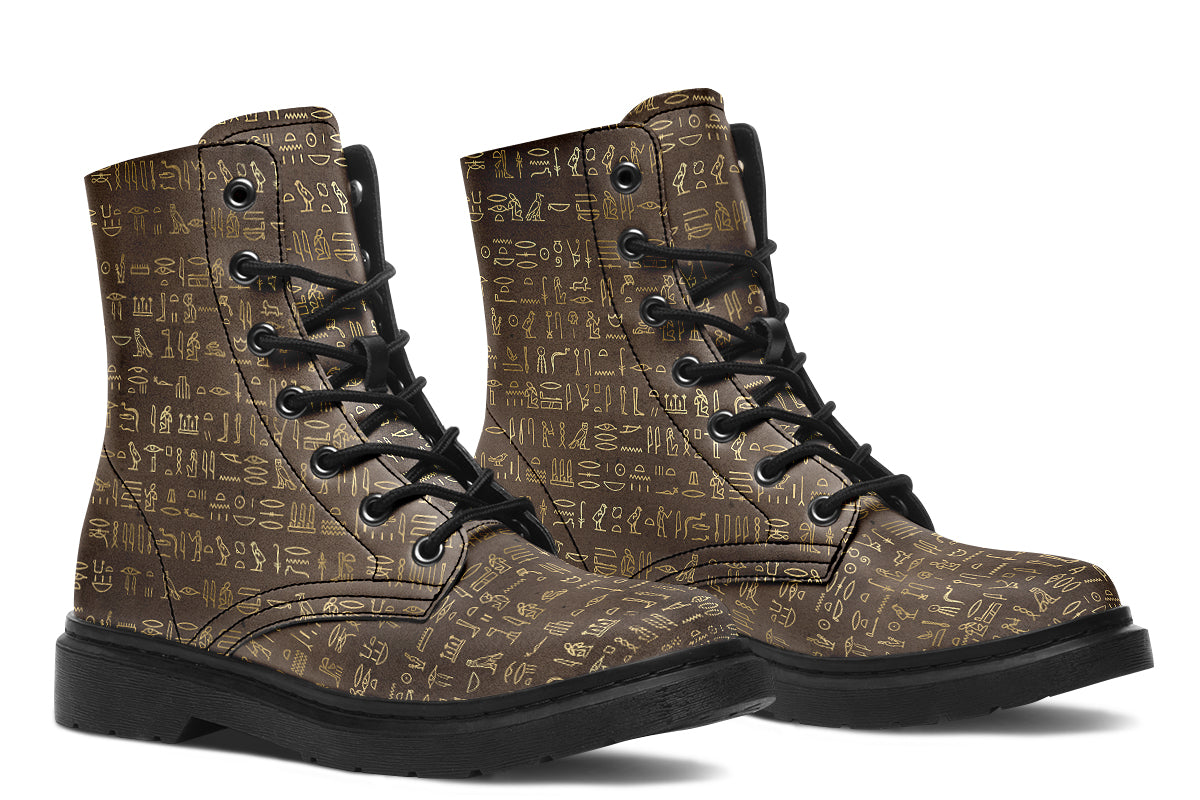 Dark brown boots with a gold hieroglyphics pattern
