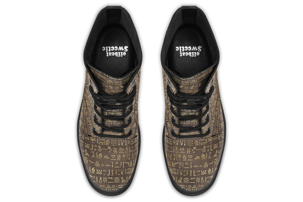 Dark brown boots with a gold hieroglyphics pattern