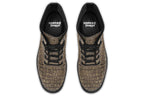 Dark brown boots with a gold hieroglyphics pattern