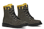 Black boots with a yellow honeycomb pattern, with the image of dripping honey on the top of the boots as if the honey is dripping down the boots