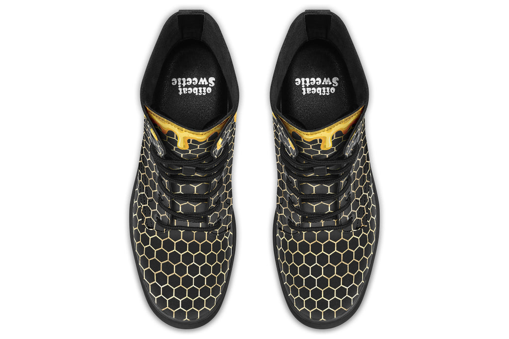 Black boots with a yellow honeycomb pattern, with the image of dripping honey on the top of the boots as if the honey is dripping down the boots