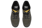 Black boots with a yellow honeycomb pattern, with the image of dripping honey on the top of the boots as if the honey is dripping down the boots