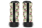 Cream-coloured boots with a pattern of dark green hummingbirds, pink flowers and green leaves